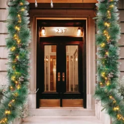 50 Warm White Pre Lit Cone Flocked Christmas Garland 9ft -Christmas Decoration Shop 9ft Christmas Flocked Garland Cone 6 result 600x600 1